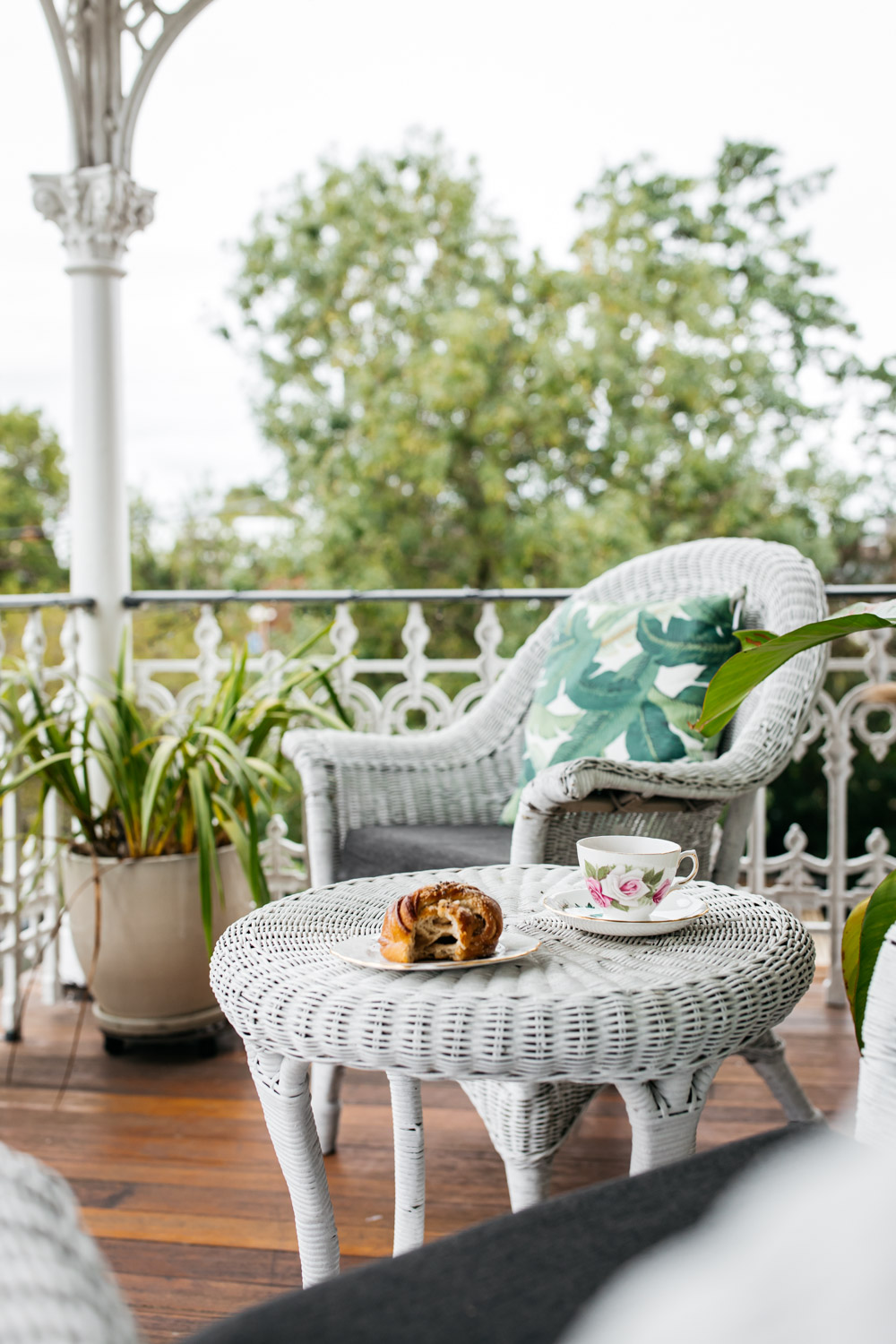 Coffee and croissant on the beautiful heritage Victorian fretwork cast iron verandah at the Post and Telegraph Boutique Accommodation in Moruya NSW